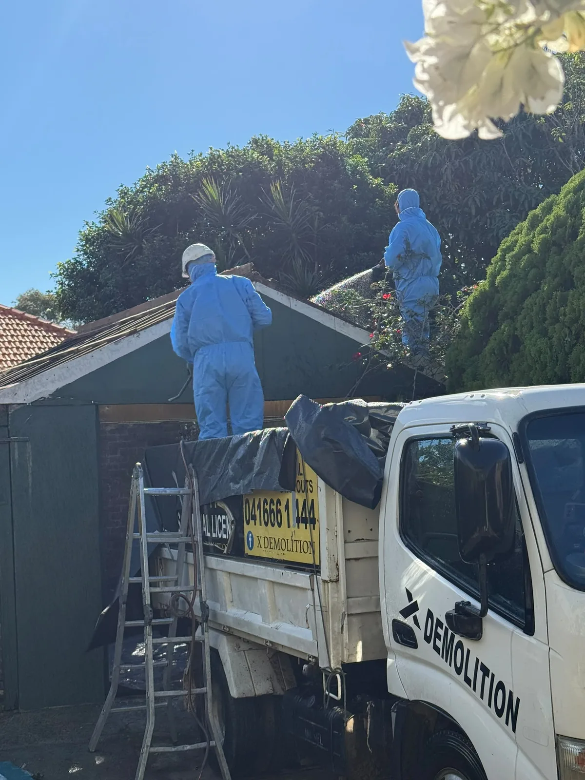 Removal team working at a roof project
